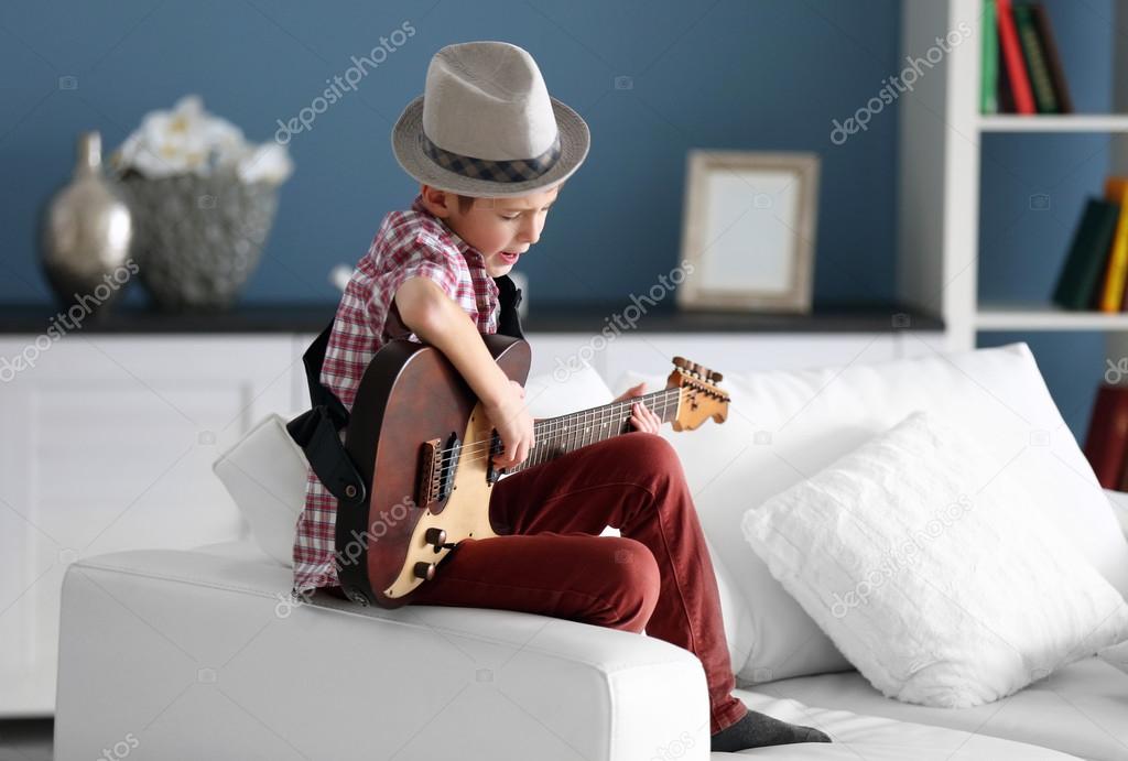 boy playing guitar 