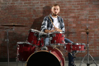 Musician playing drums clipart