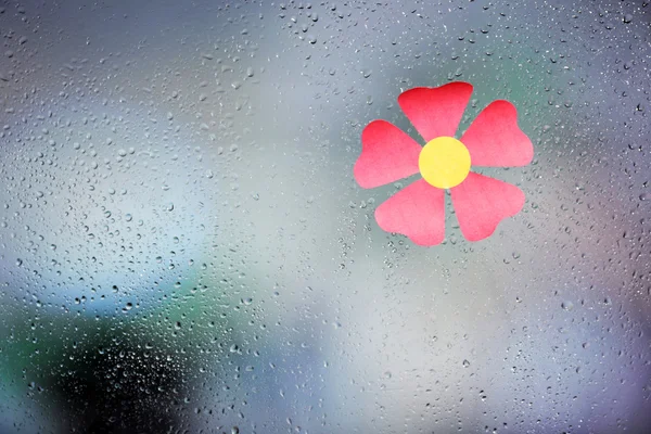 Sticker on wet window — Stock Photo, Image