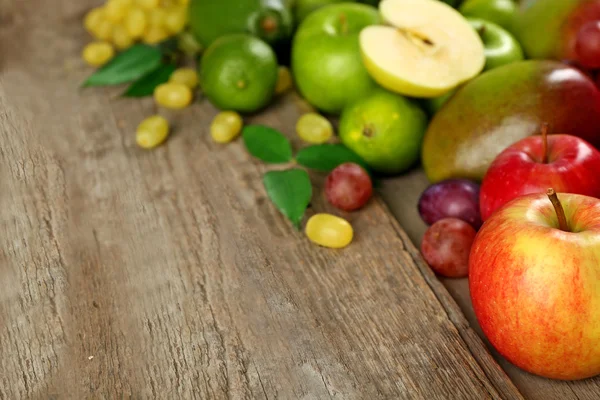 Fruits on wooden background — Stock Photo, Image