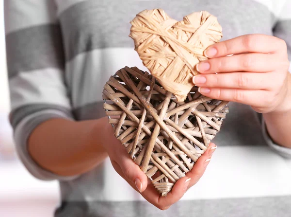 Craft hearts in female hands — Stock Photo, Image