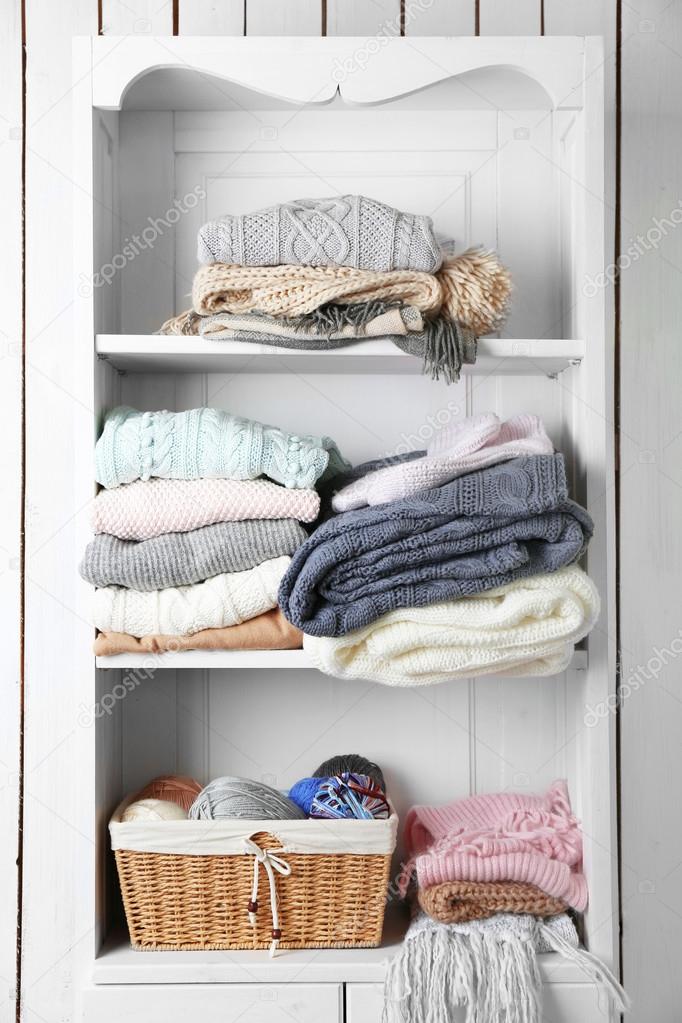 Knitting clothes on shelf