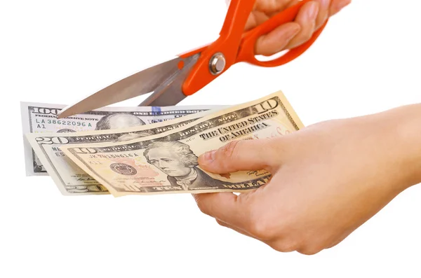 Manos con tijeras cortando dólares —  Fotos de Stock