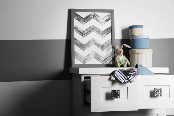 Clothes in wooden chest of drawer — Stock Photo, Image