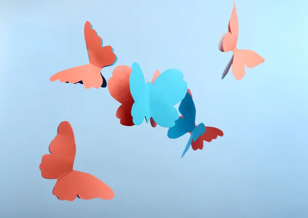 Paper butterflies on blue — Stock Photo, Image