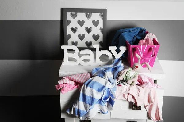 Clothes in wooden chest of drawer — Stock Photo, Image