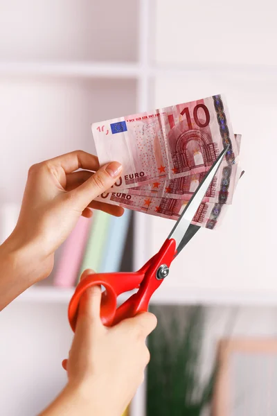 Hands with scissors cutting Euro — Stock Photo, Image