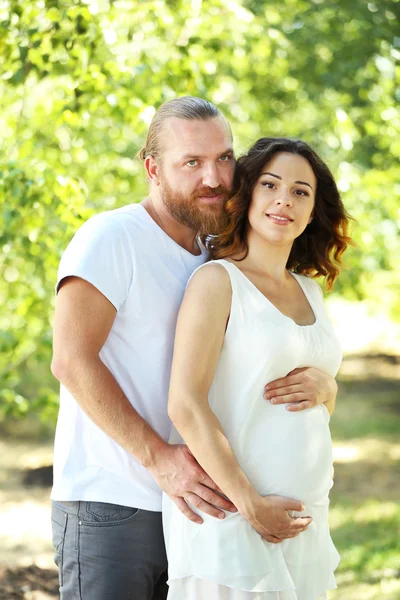 Happy man and woman in park — Stock Photo, Image