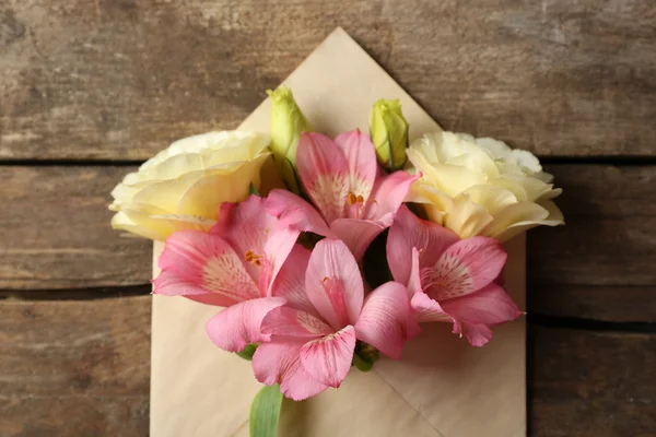 Pink alstroemeria in envelope — Stock Photo, Image