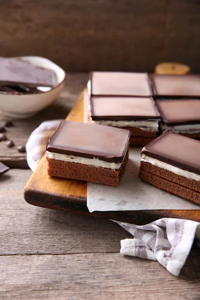 Delicious chocolate brownies on wooden background — Stock Photo, Image