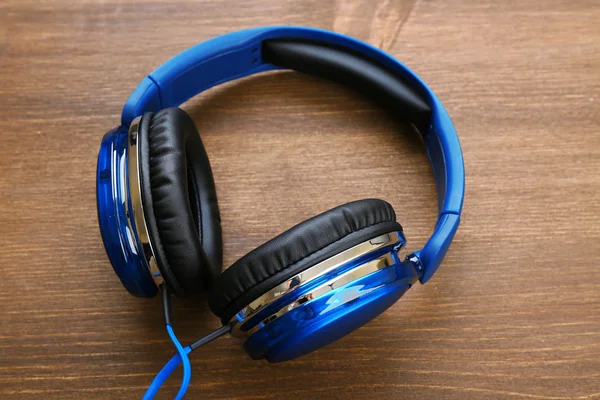 Headphones on wooden background — Stock Photo, Image