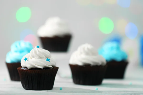 Chocolate cupcakes on a table — Stock Photo, Image