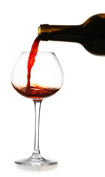 Red wine pouring in glass, isolated on white — Stock Photo, Image