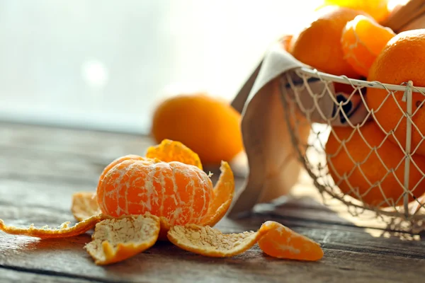 Tangerines on old wooden table, close up — Stock Photo, Image