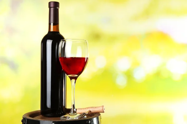 Wine on blurred natural background — Stock Photo, Image