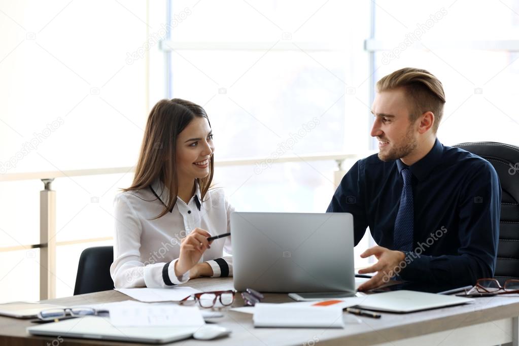 Businessman and businesswoman working