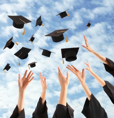 Graduates hands throwing graduation hats clipart