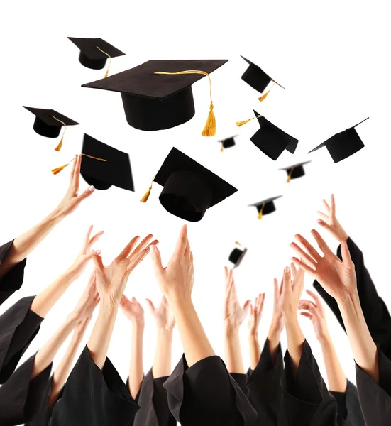 Graduates hands throwing graduation hats — Stock Photo, Image
