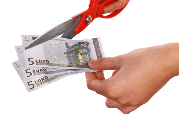 Hands with scissors cutting Euro