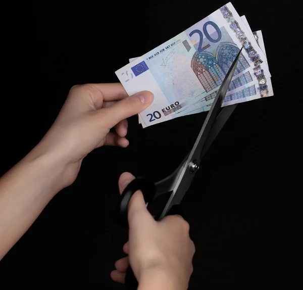 Hands with scissors cutting Euro — Stock Photo, Image