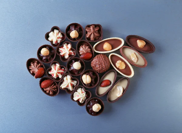 Chocolate sweets on dark grey background — Stock Photo, Image