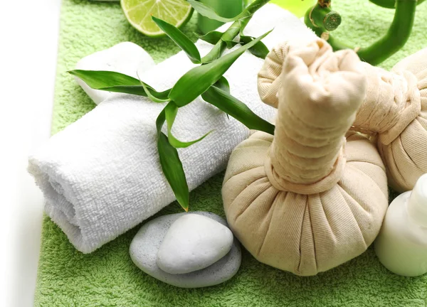 Relaxing spa set on green soft towel, close up — Stock Photo, Image