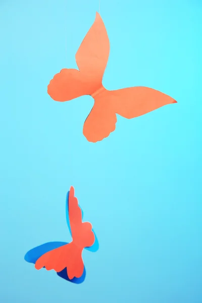 Paper butterflies on blue — Stock Photo, Image