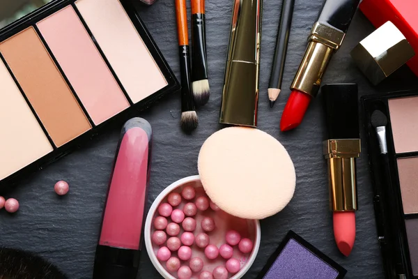 Cosmetics on dark background, closeup — Stock Photo, Image