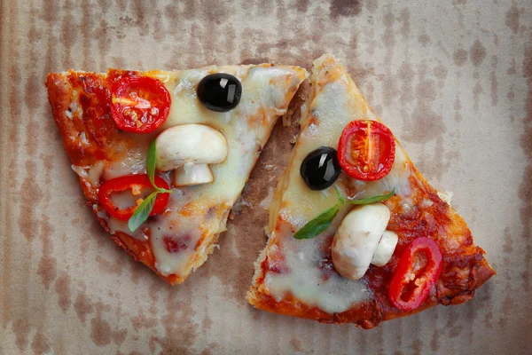 Slices of tasty pizza on carton, close up — Stock Photo, Image