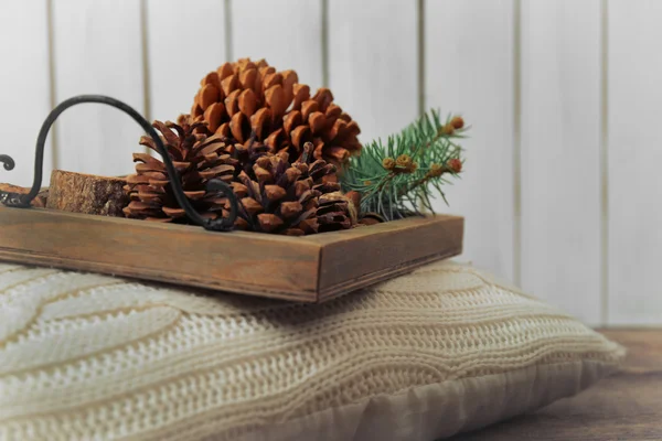 Wooden basket with pine cones — Stock Photo, Image