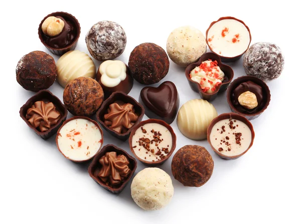 Colección en forma de corazón de caramelos y dulces de chocolate, aislados en blanco — Foto de Stock