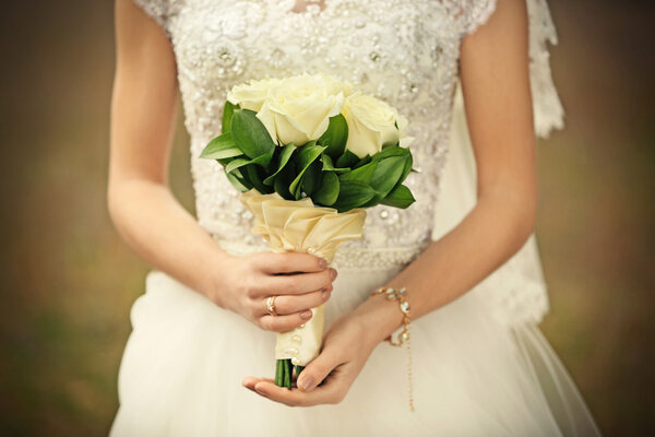 Wedding bouquet in hands 