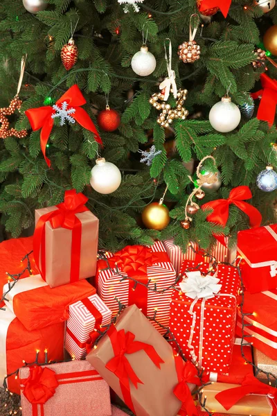 Christmas gifts under the fir tree — Stock Photo, Image