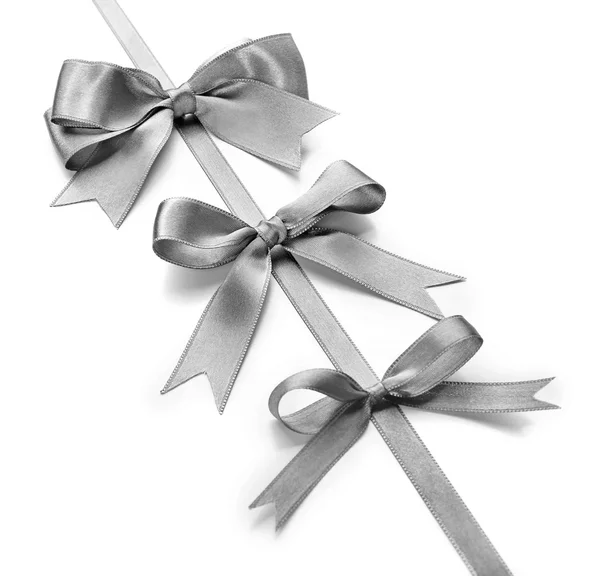 Silver silk ribbon with beautiful bows — Stock Photo, Image