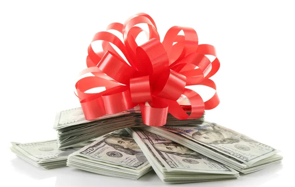 Pile of dollars with bow as gift isolated on white — Stock Photo, Image