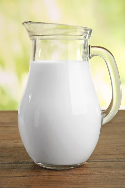 Jar of milk on natural background — Stock Photo, Image