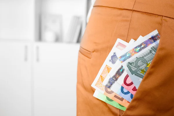 Euro money in pocket of brown pants — Stock Photo, Image