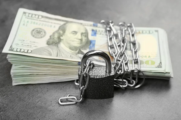 Dollars currency with lock and chain — Stock Photo, Image