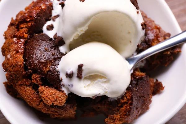 Chocolate lava cake with ice-cream and spoon, close-up — Stock Photo, Image