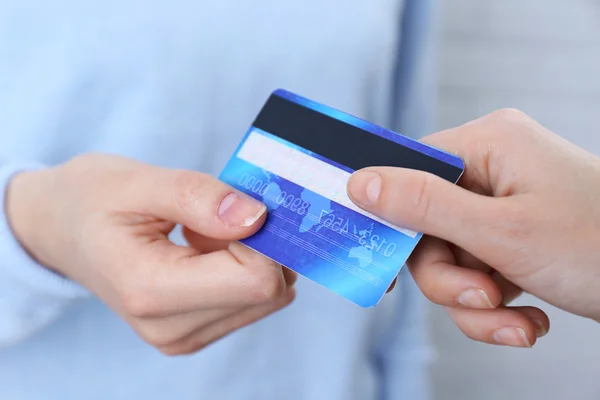 Hands holding a credit card Stock Image