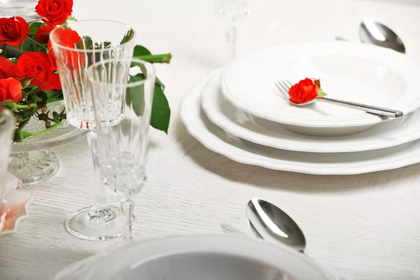 Served table with flowers in restaurant, closeup — Stock Photo, Image