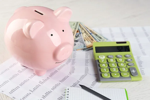 Piggy bank, calculator, dollars — Stock Photo, Image