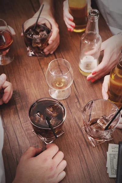 Friends having alcoholic drinks in the bar