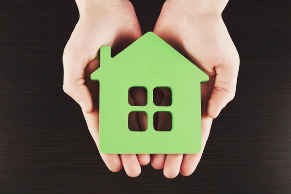 Female hands holding house — Stock Photo, Image