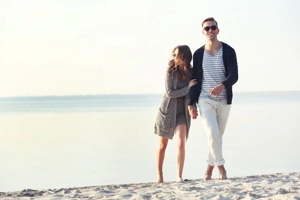 Young couple on the riverside — Stock Photo, Image