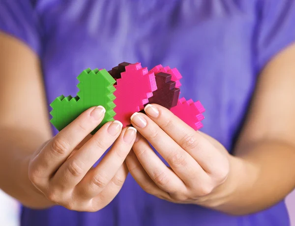 Plastic puzzle hearts — Stock Photo, Image