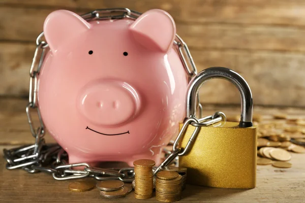Piggy bank and chains — Stock Photo, Image