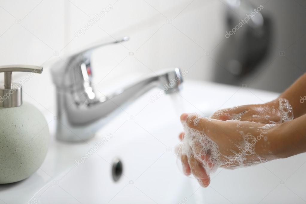 Washing of hands with soap 