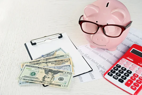 Piggy bank, calculator, dollars — Stock Photo, Image