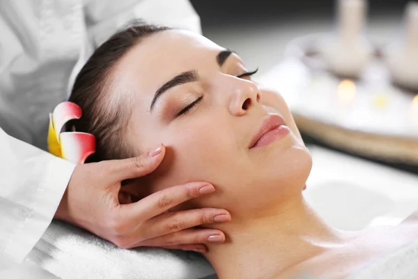 Woman relaxing with face massage — Stock Photo, Image